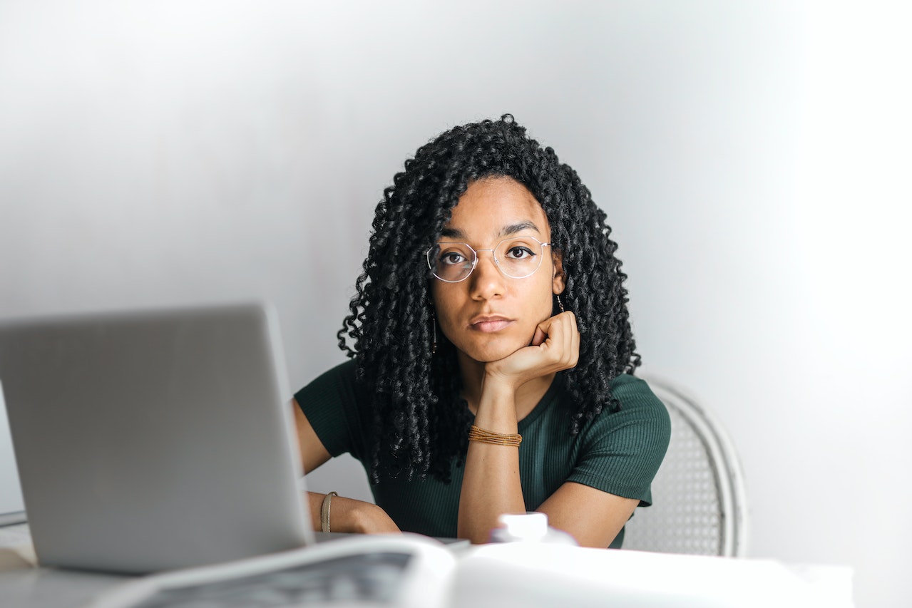 a woman sitting in front of computer